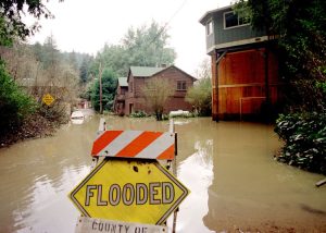 Flooded sign image via 89.3KPCC